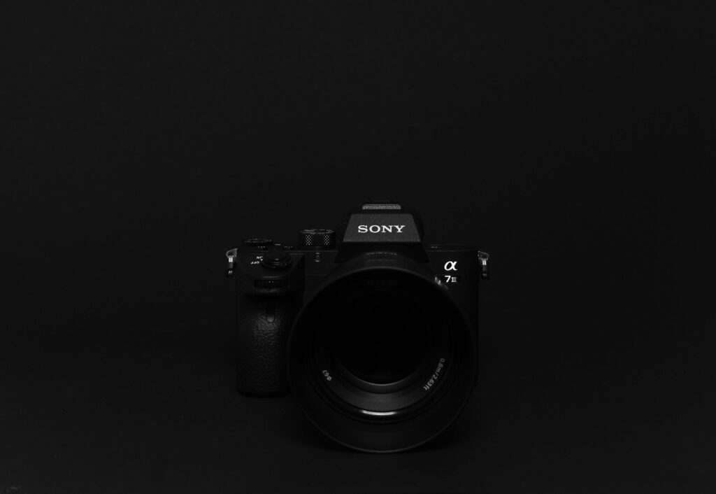 pexels photo 2929412 2929412 1 Minimalist image of a black Sony camera against a black background, perfect for tech themes.